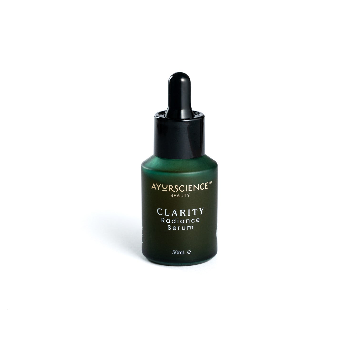 A dark green bottle with a dropper containing the CLARITY Radiance Serum by AYURSCIENCE Beauty.